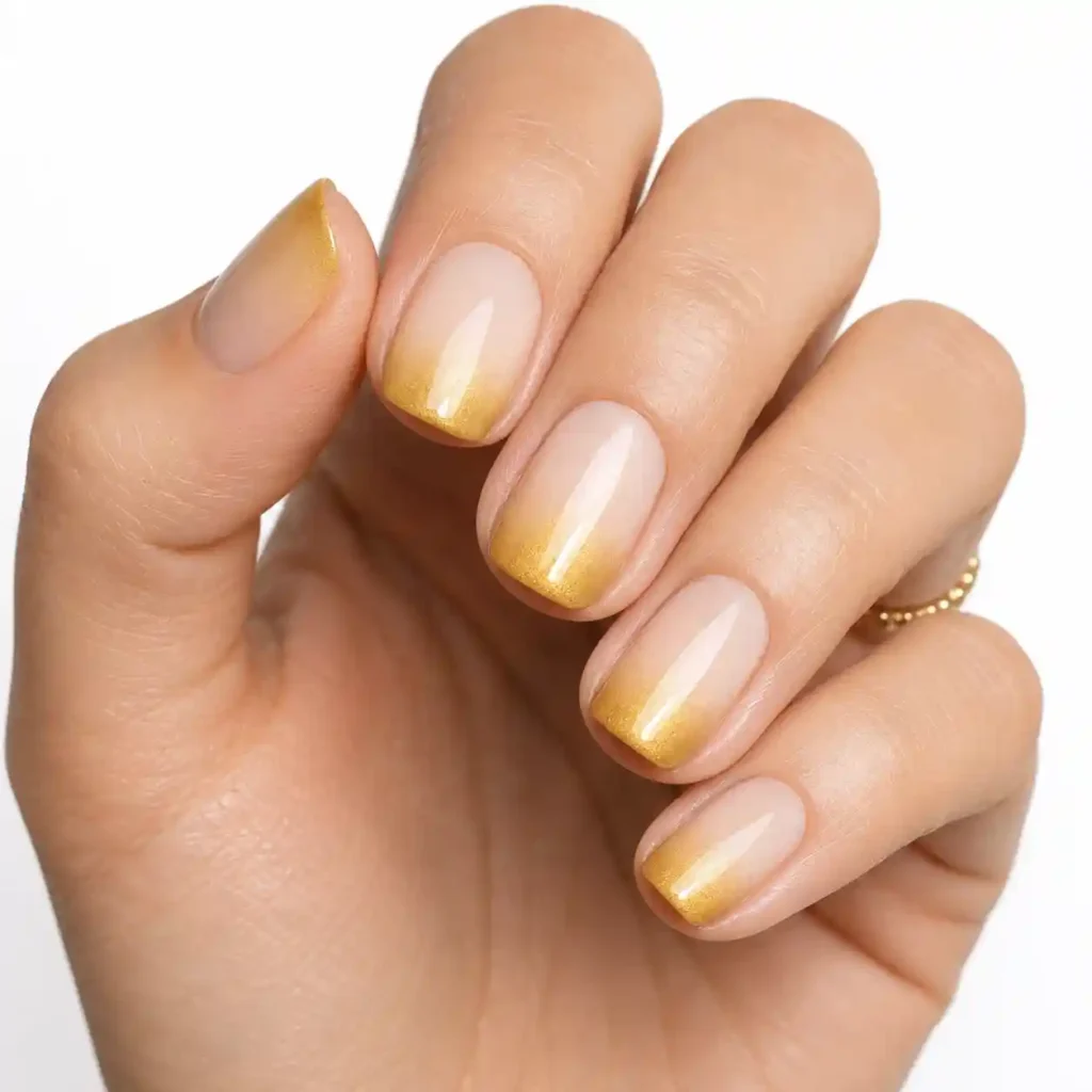 Ombre from Nude to Gold Nails